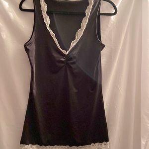 Tank tops 2 for $8 ….Sleeveless shirt with delicate lace trim size medium